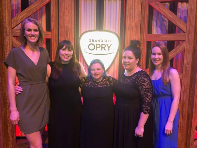 The women of Country Aircheck at a career achievement celebration for owner Lon Helton in 2019. Pictured L-R: Shelby Farrer, April Johnson, Monta Vaden, Kelley Hampton, and Caitlin DeForest
